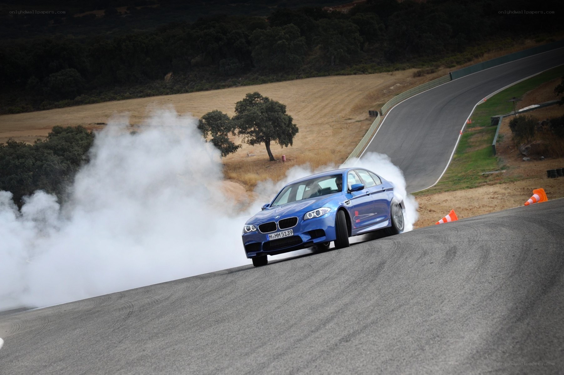 Blue BMW drifting on track