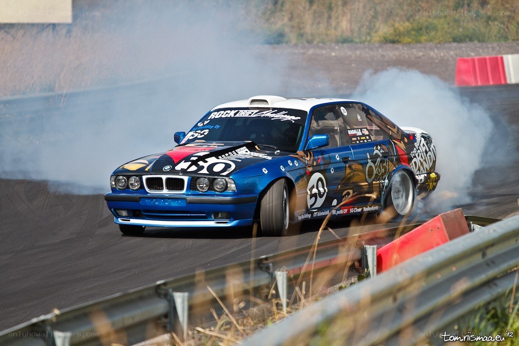Blue BMW drifting on track