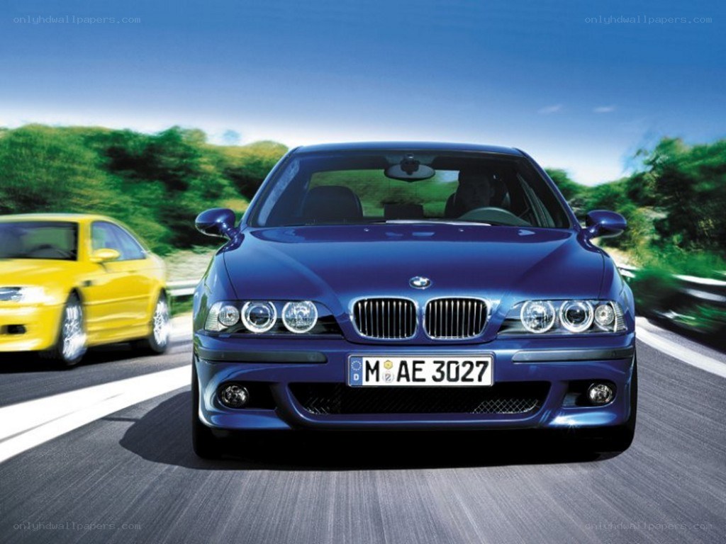 Blue BMW driving on road