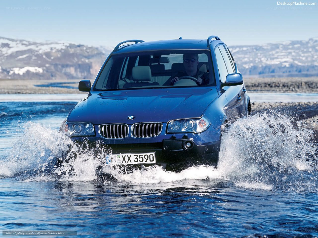 Blue BMW driving through water