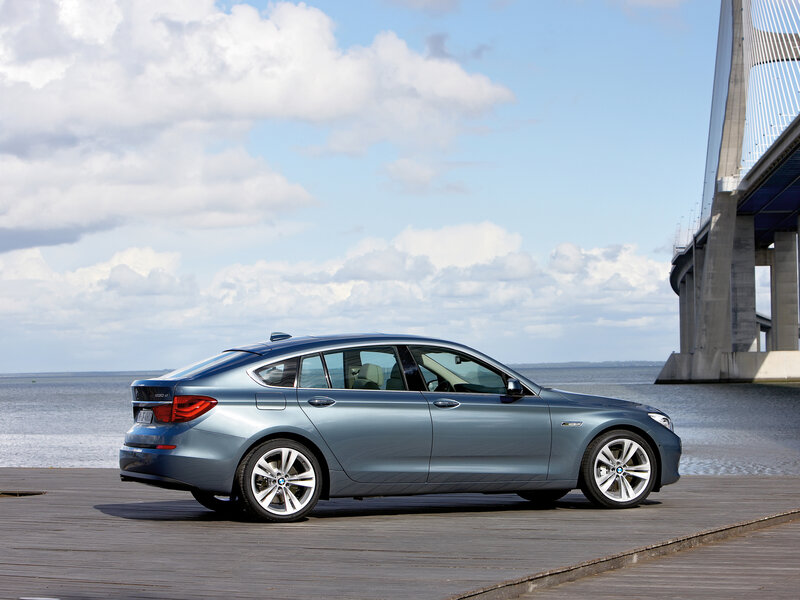 Blue BMW Gran Turismo by the water
