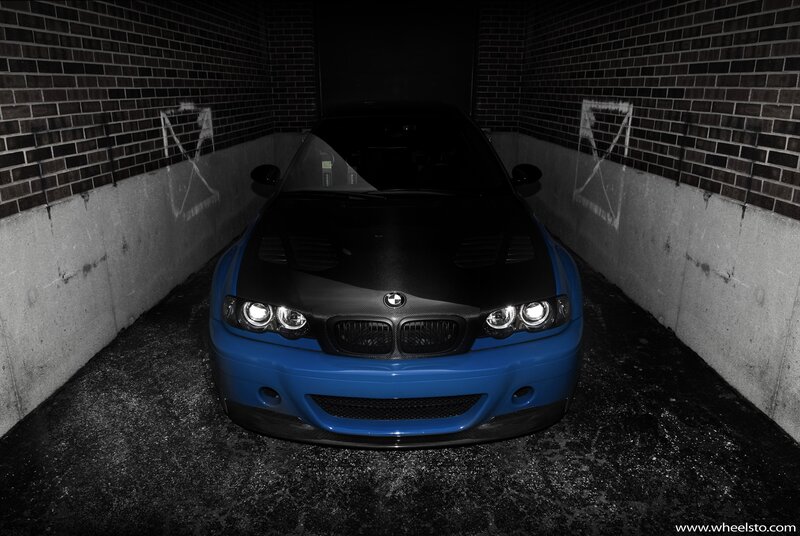 Blue BMW in a garage