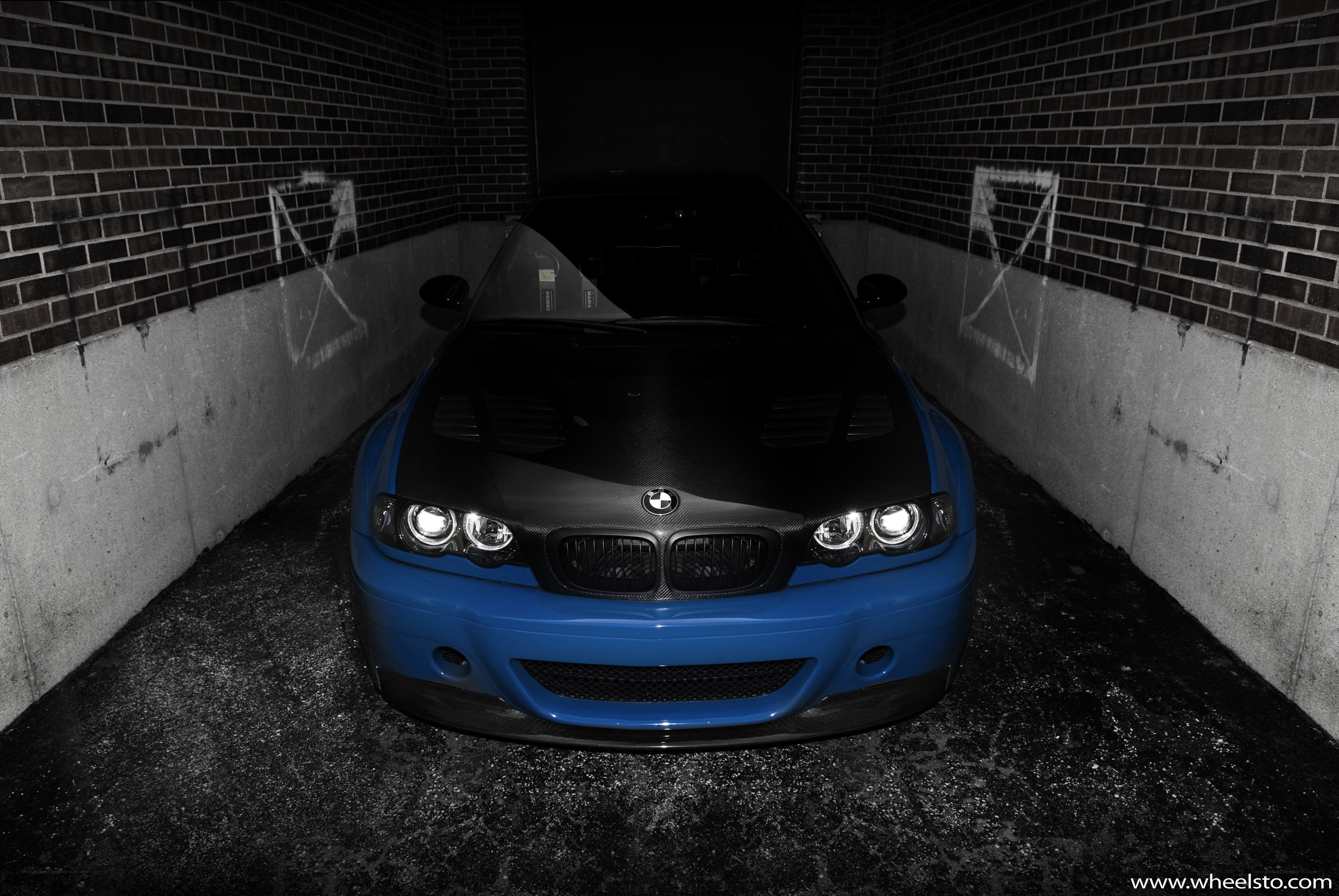 Blue BMW in a garage
