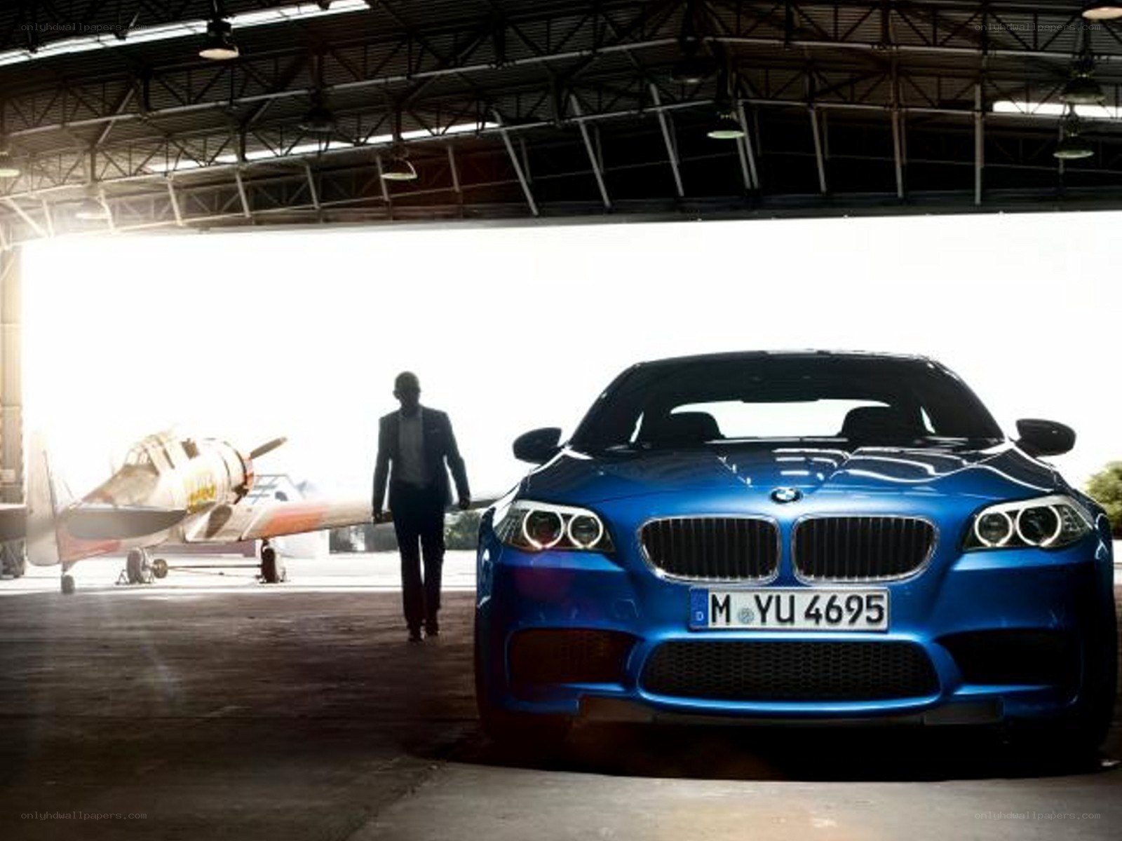 Blue BMW in a hangar