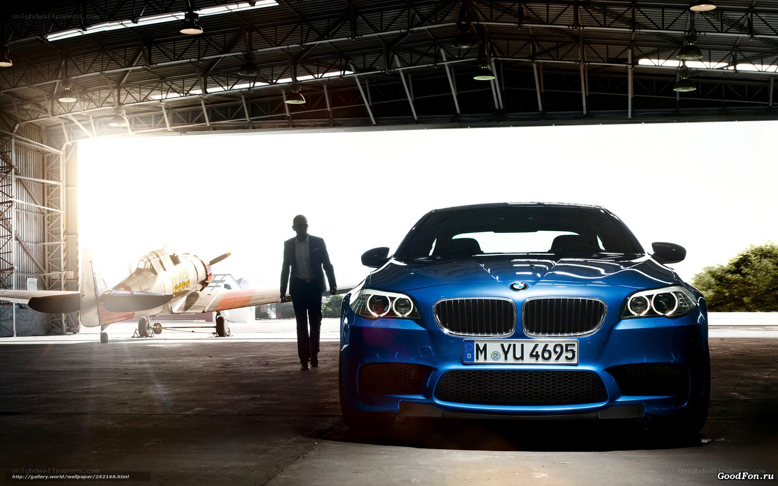Blue BMW in a hangar