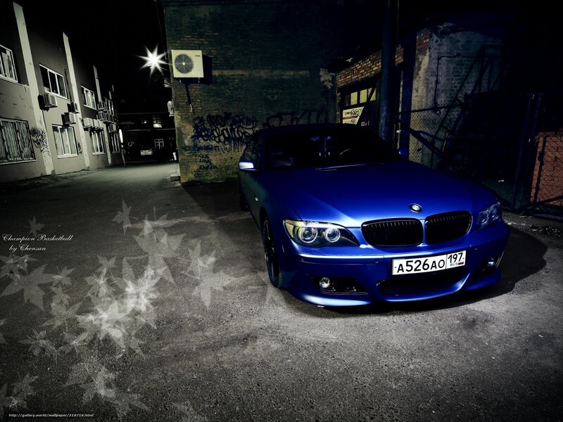 Blue BMW in alley at night