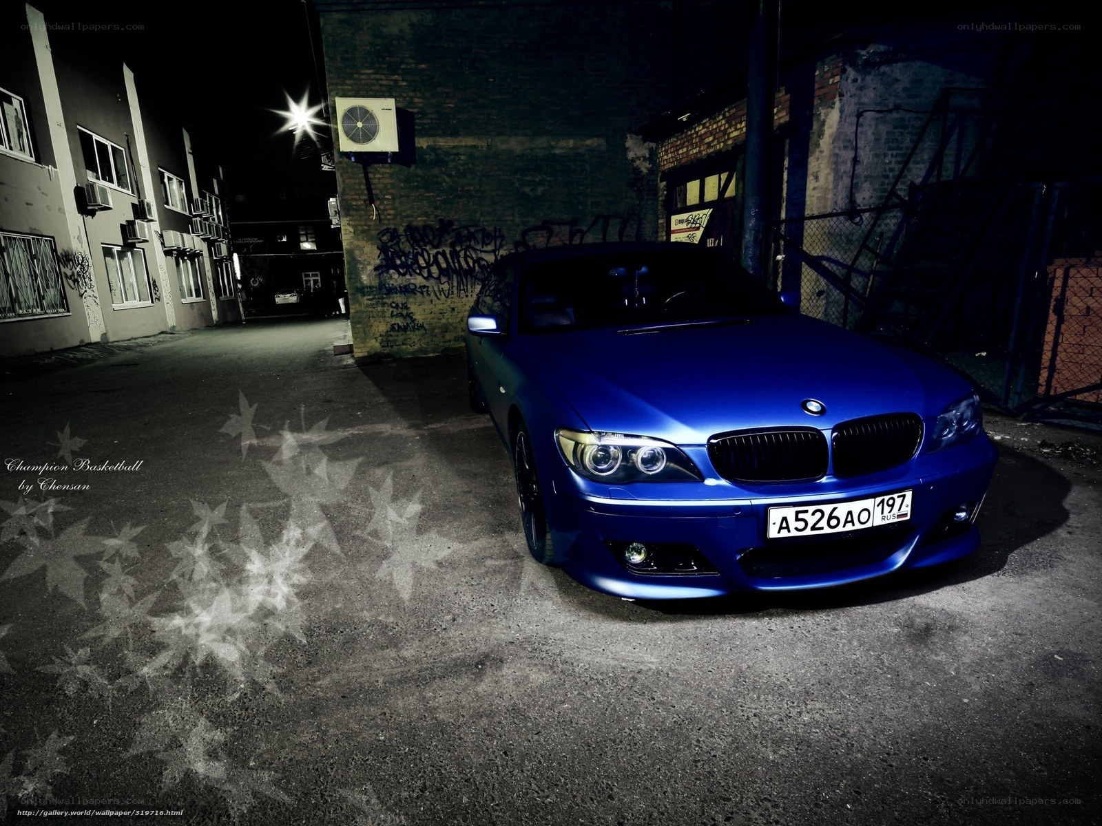 Blue BMW in alley at night