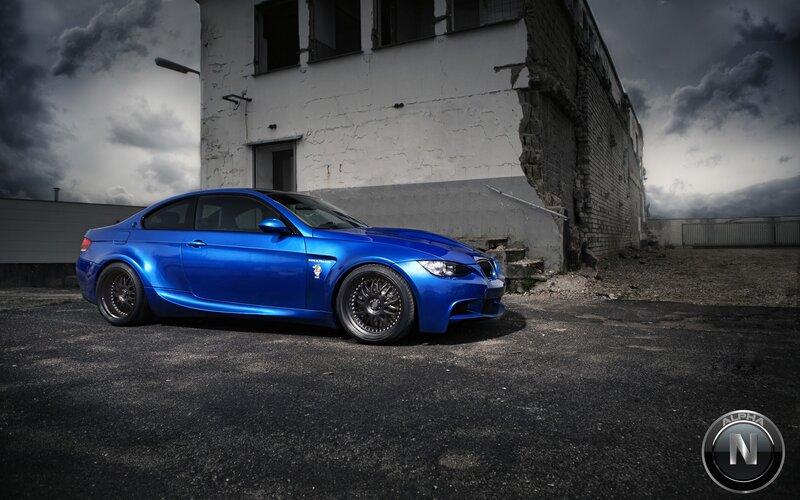 Blue BMW in an abandoned lot