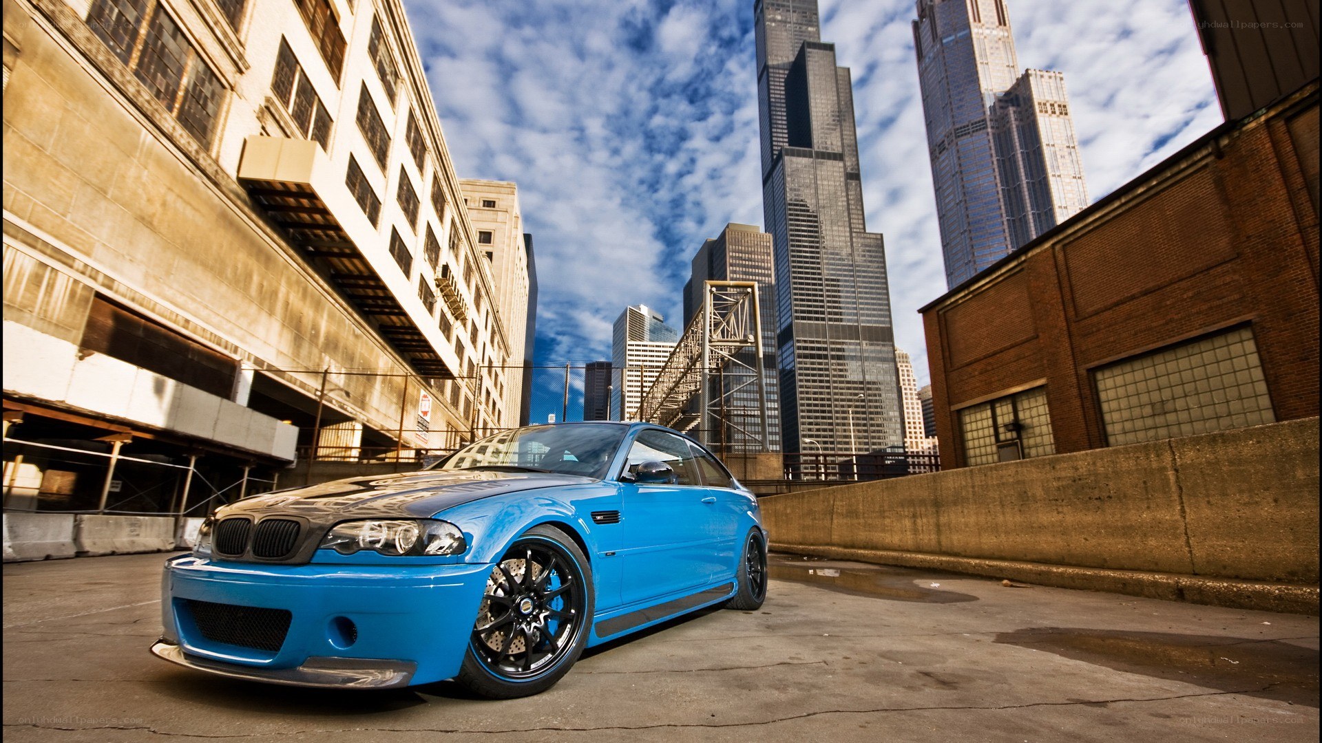 Blue BMW in Chicago cityscape