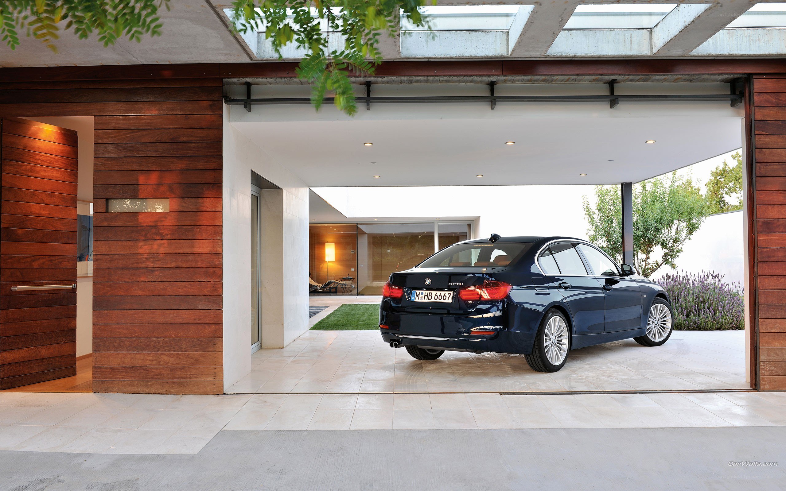 Blue BMW in modern garage