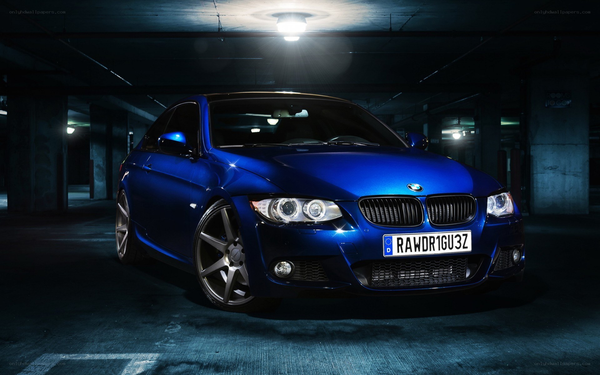 blue bmw in parking garage