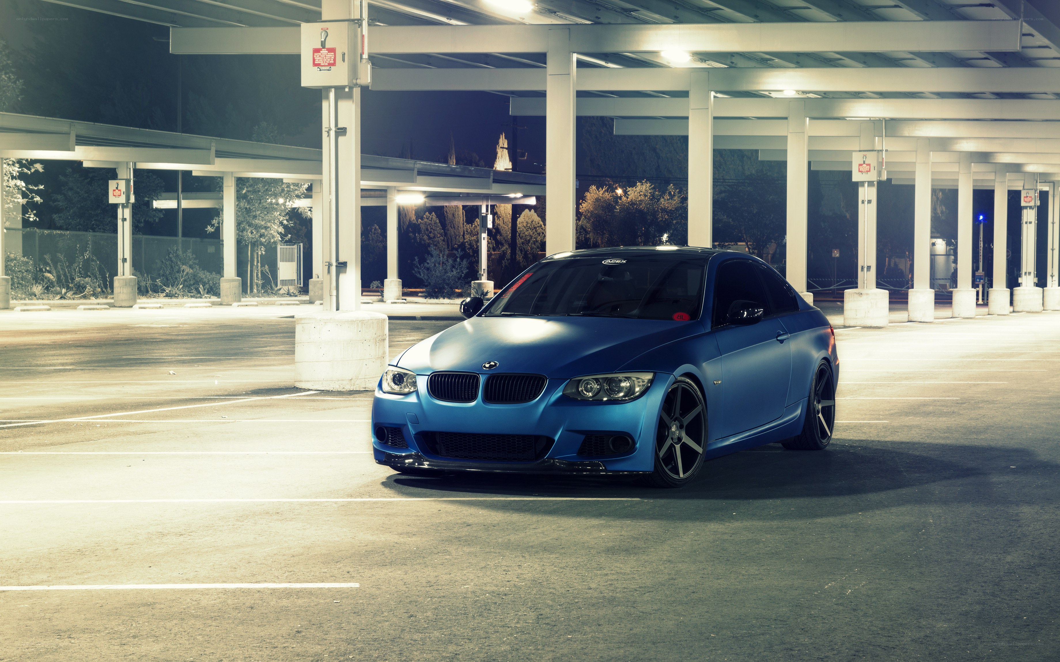 blue bmw in parking garage