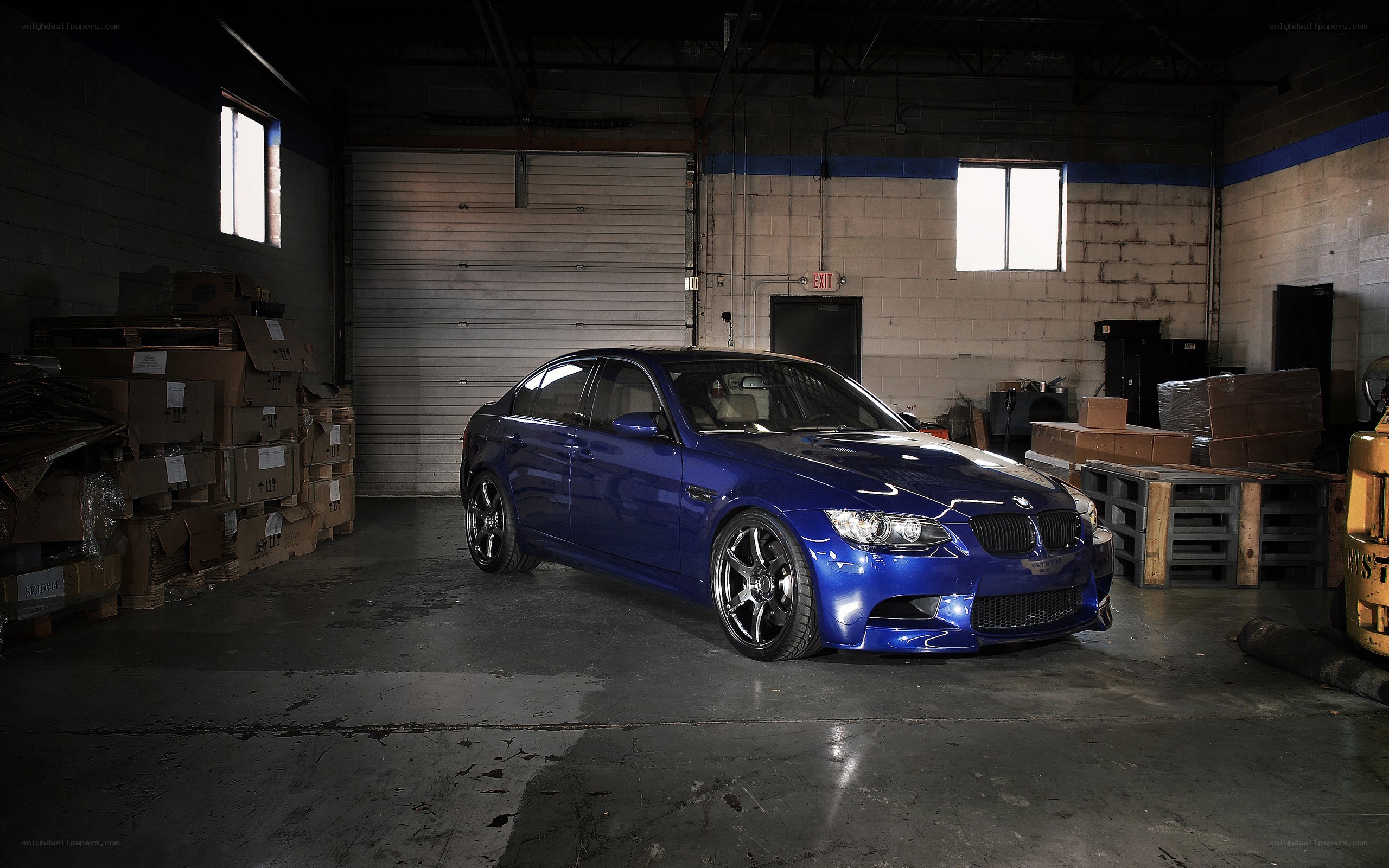 Blue BMW in warehouse