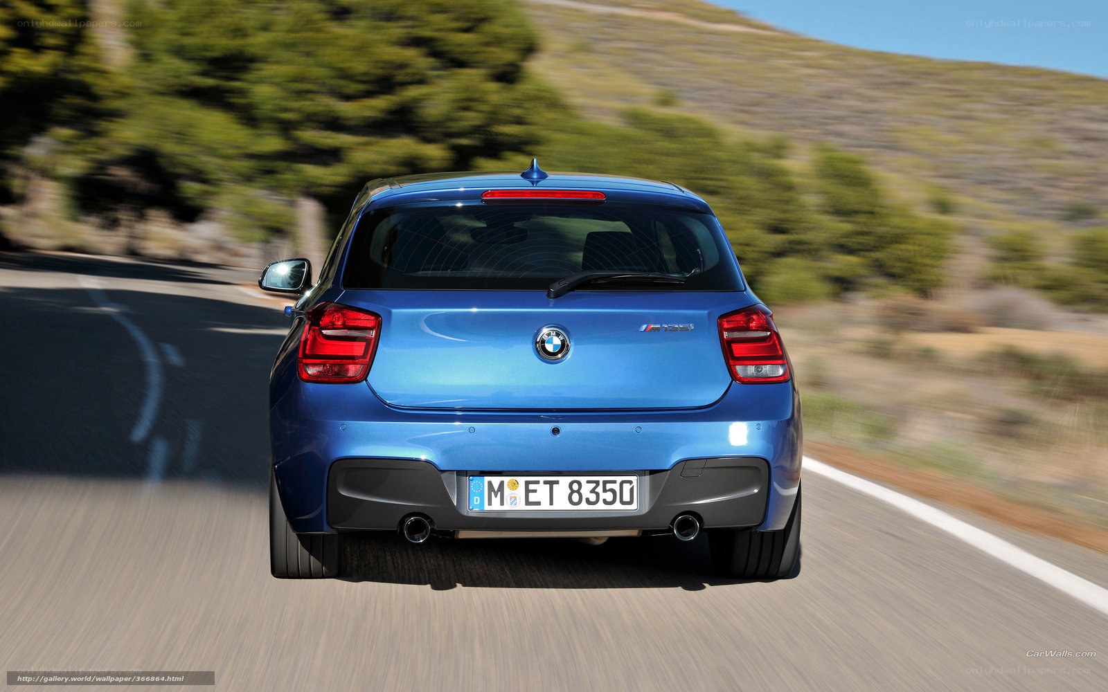 blue bmw m135i in motion