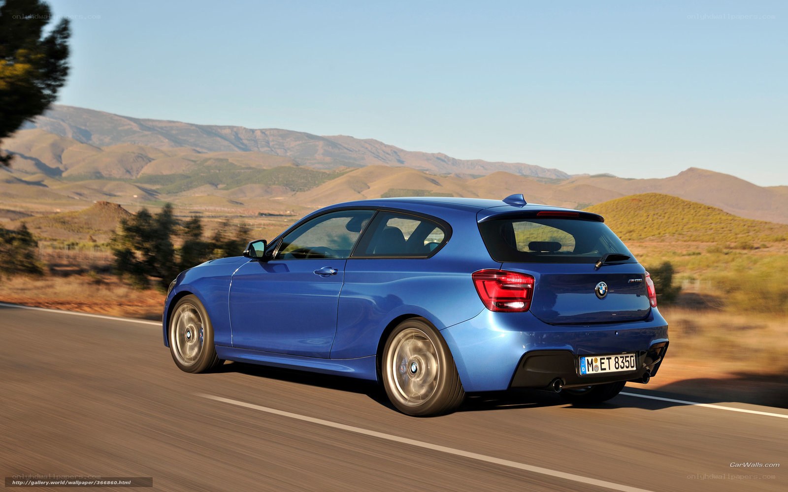 blue bmw m135i on road