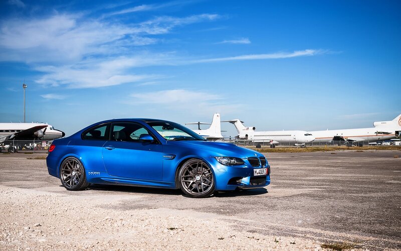 Blue BMW M3 at airport