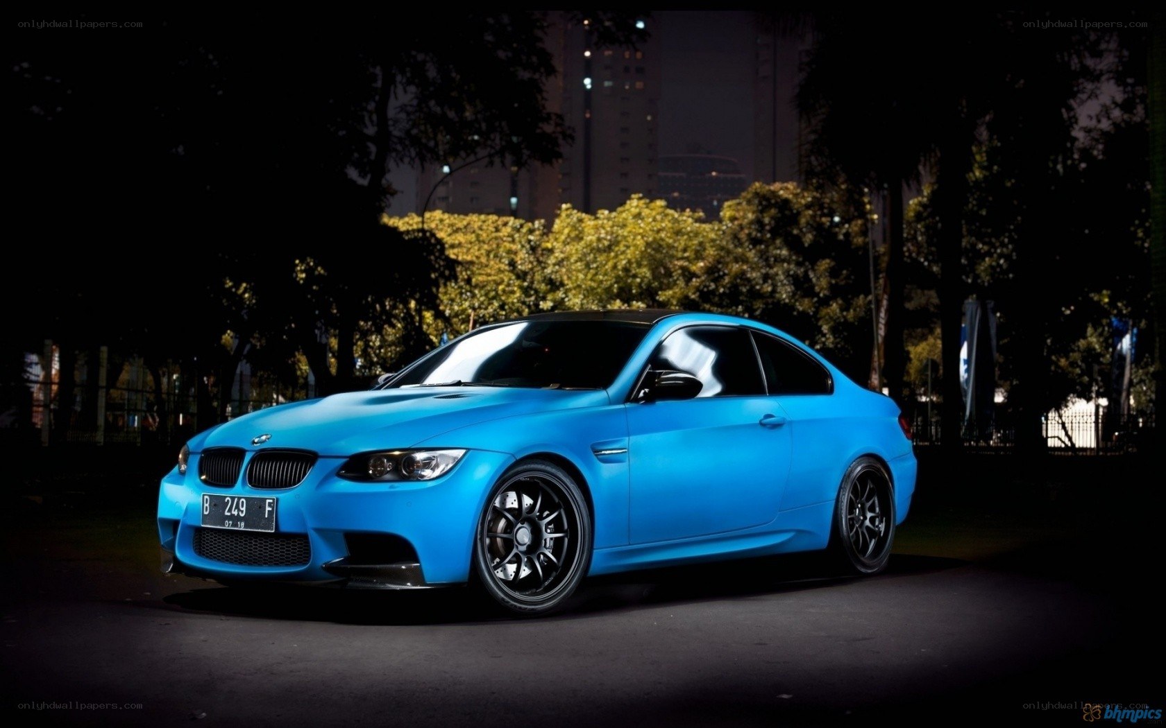Blue BMW M3 at night
