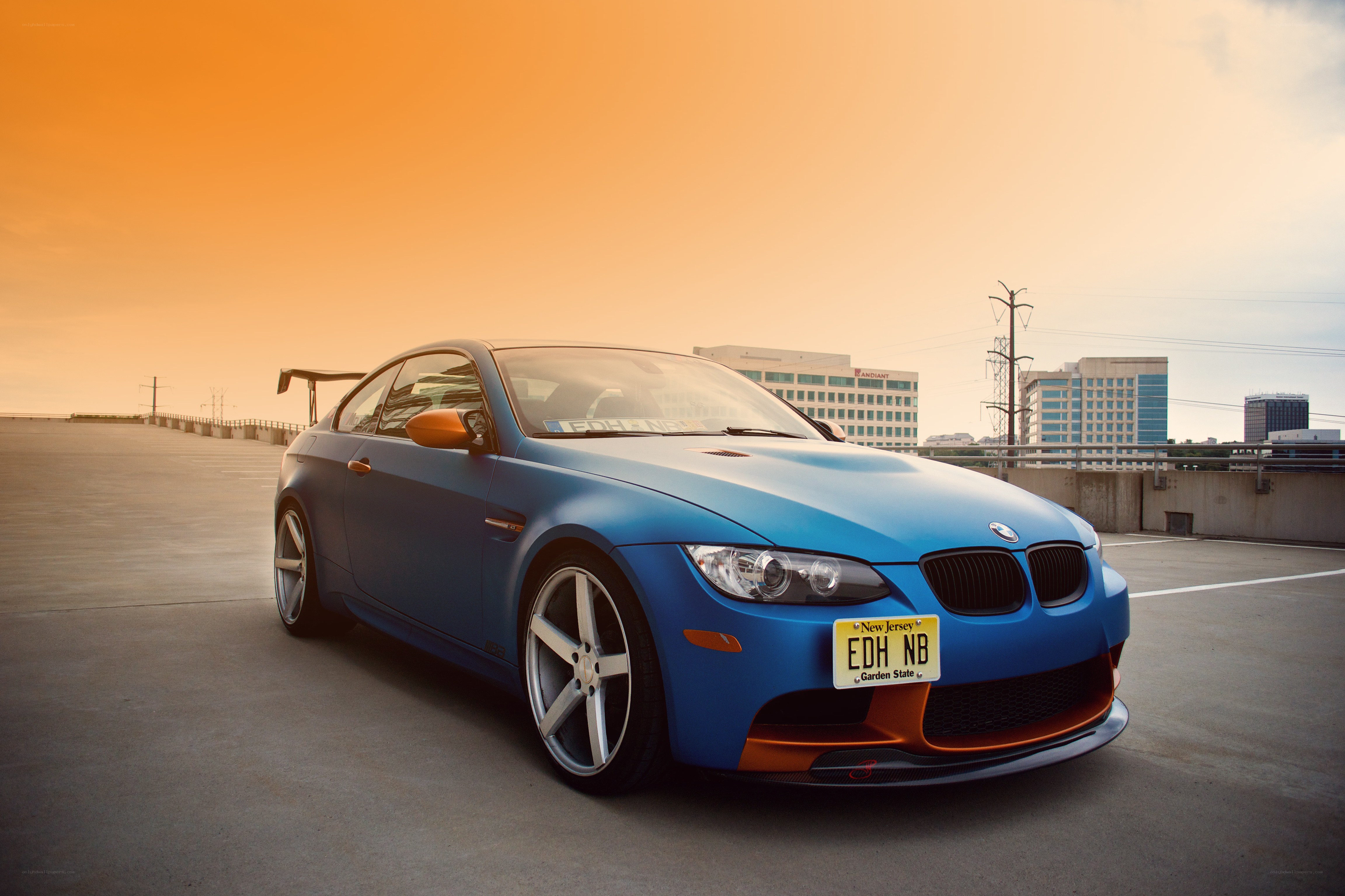 Blue BMW M3 at sunset