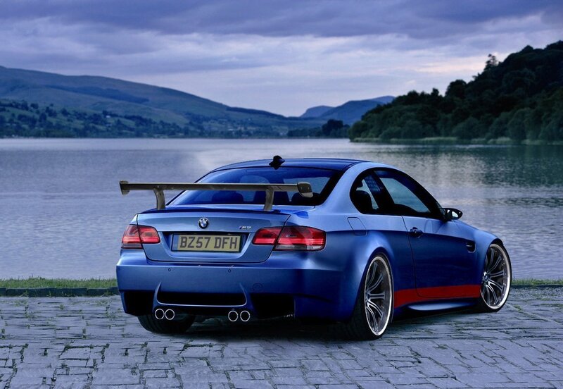 Blue BMW M3 by a lake