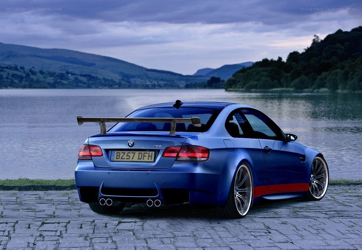 Blue BMW M3 by a lake