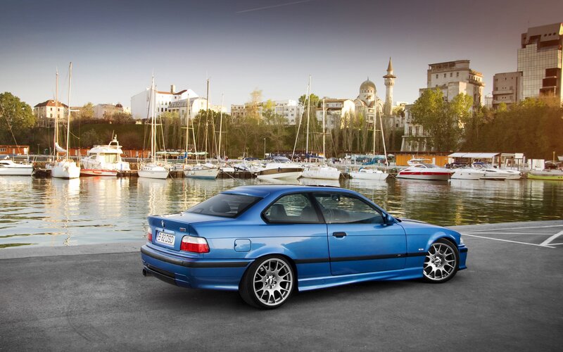 Blue BMW M3 by the harbor