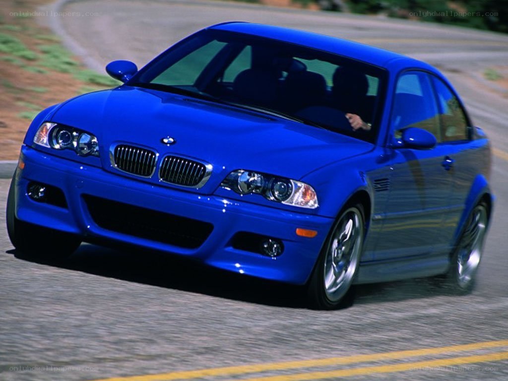 blue bmw m3 driving on road