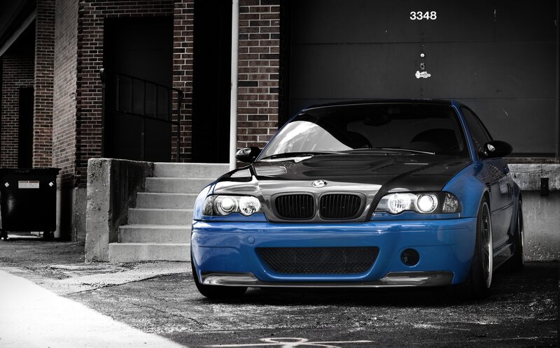blue bmw m3 in alley