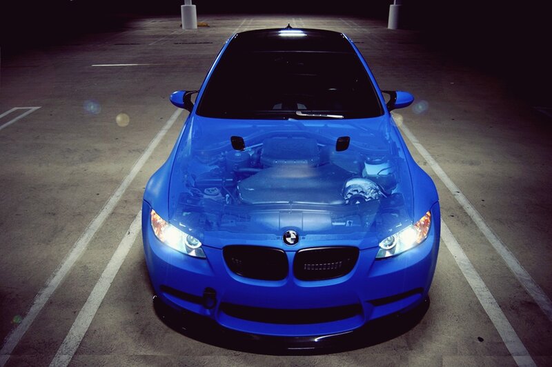 blue bmw m3 in parking garage