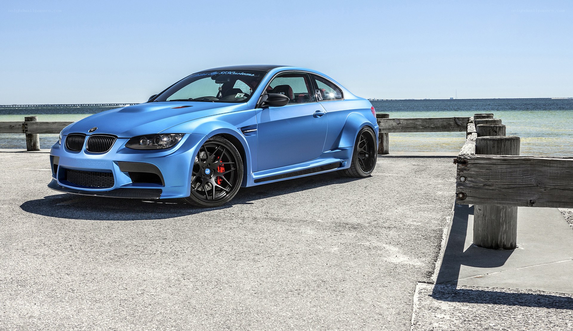 Blue BMW M3 on a pier