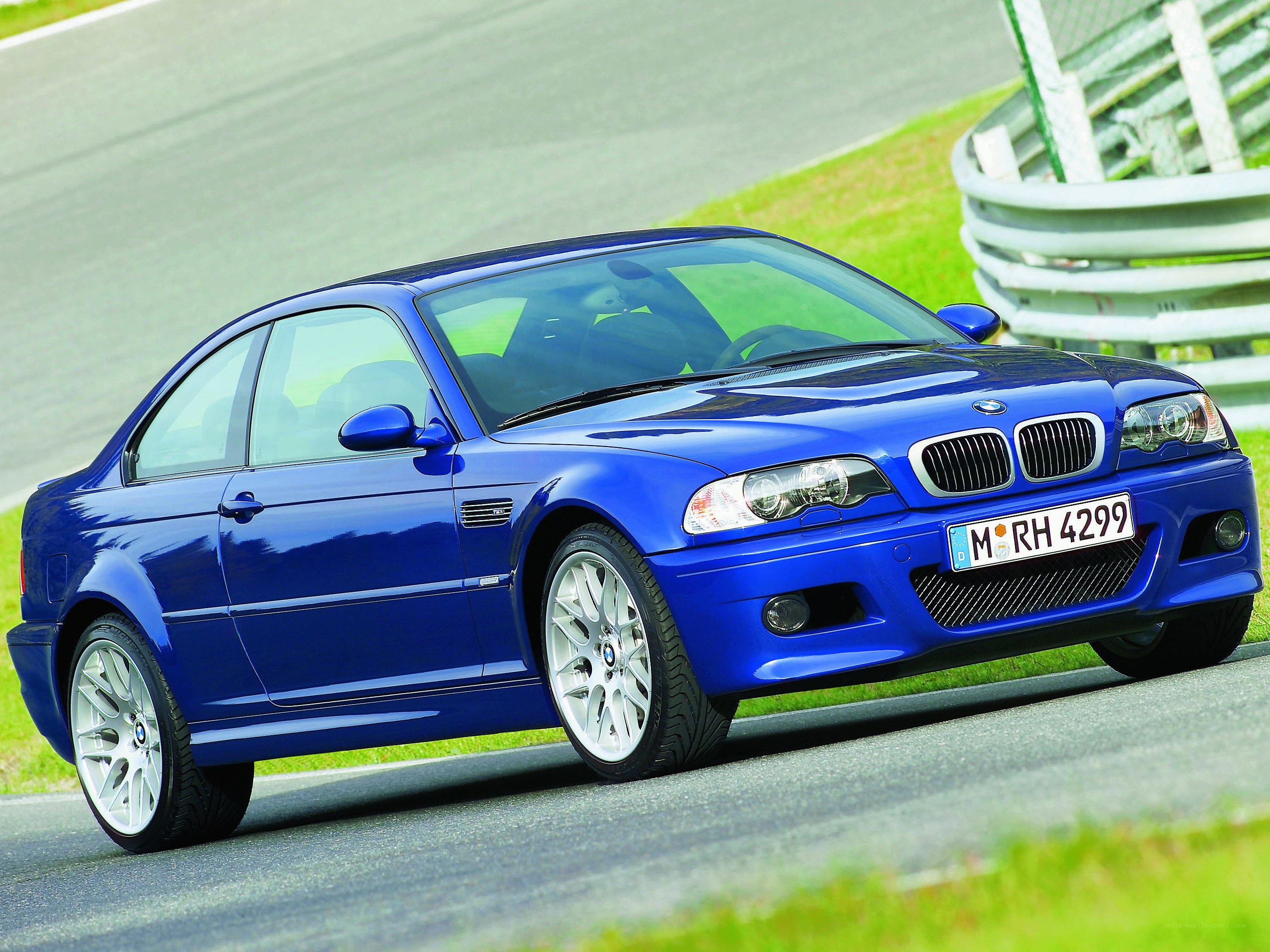 Blue BMW M3 on a racetrack