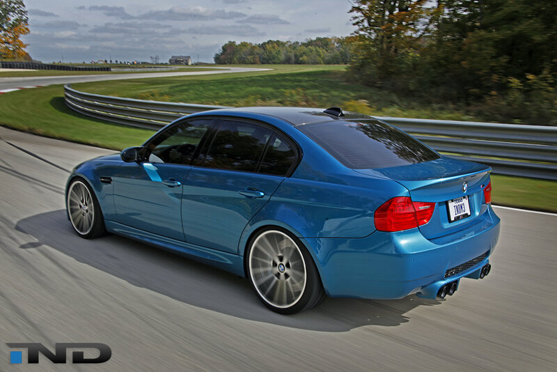blue bmw m3 on a racetrack