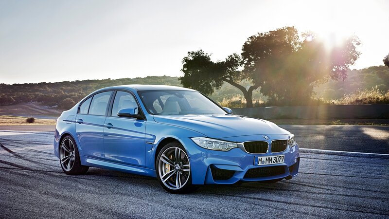 Blue BMW M3 on a racetrack