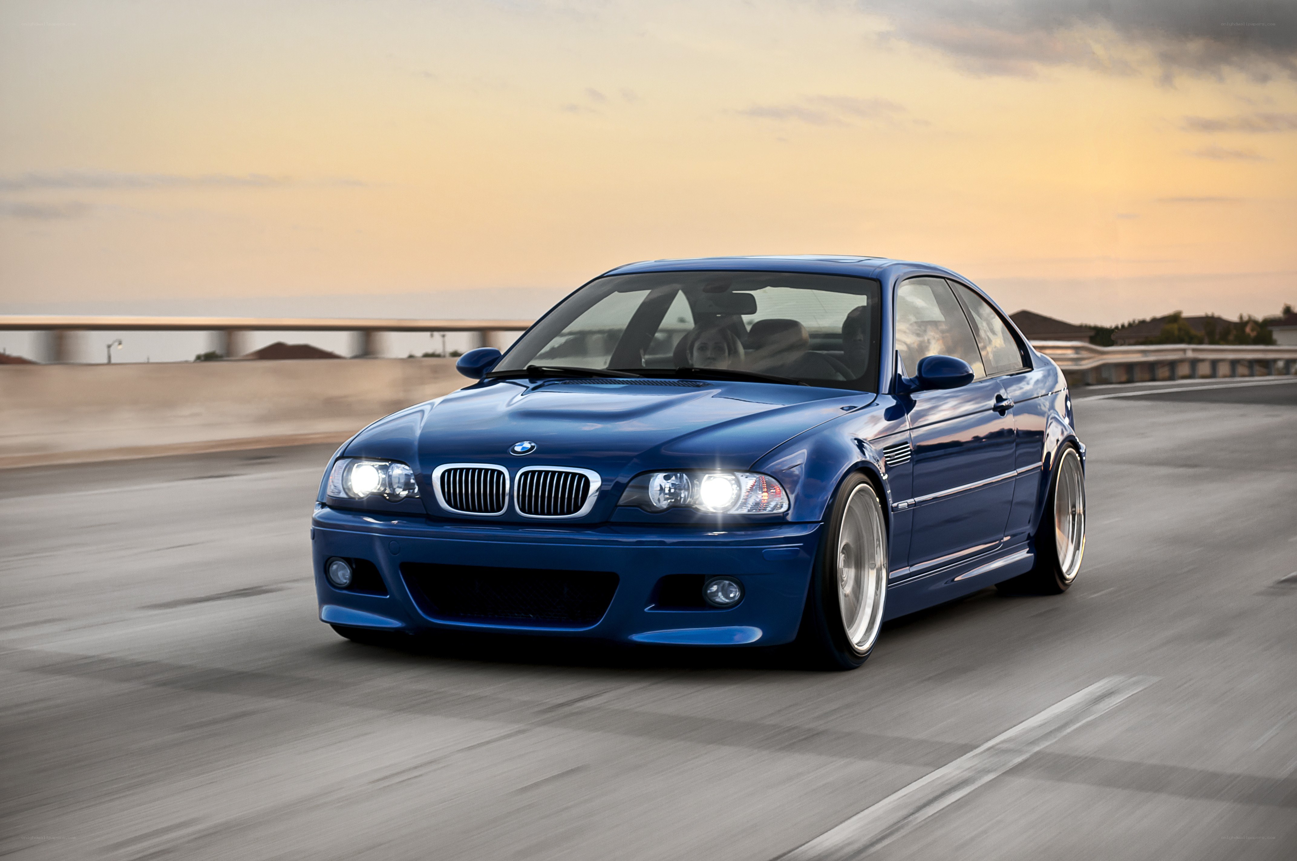 blue bmw m3 on a road