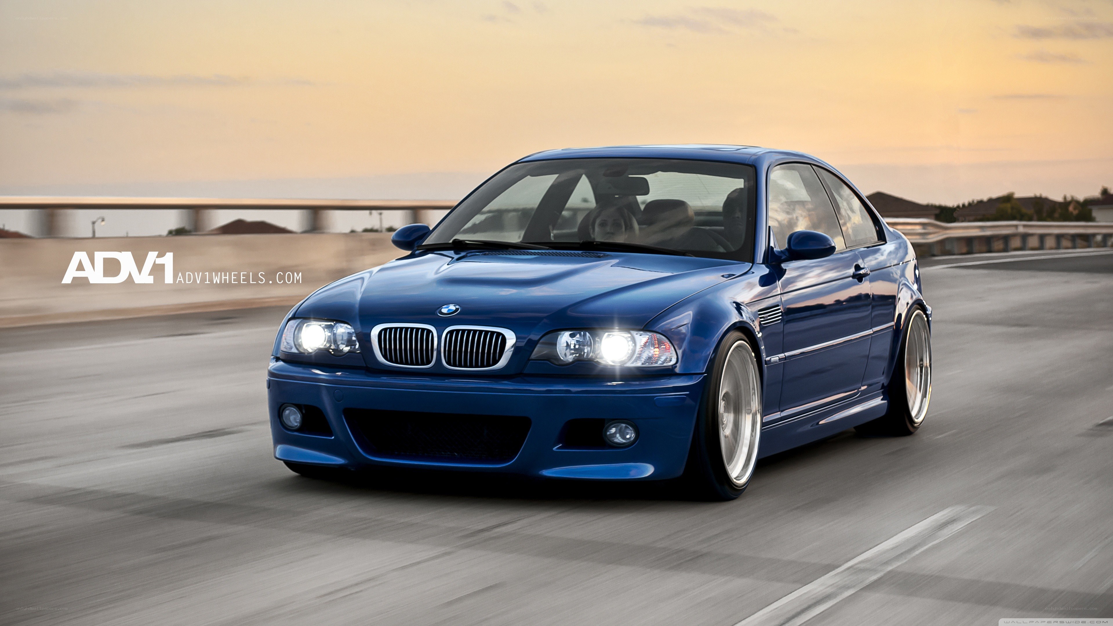 blue bmw m3 on a road