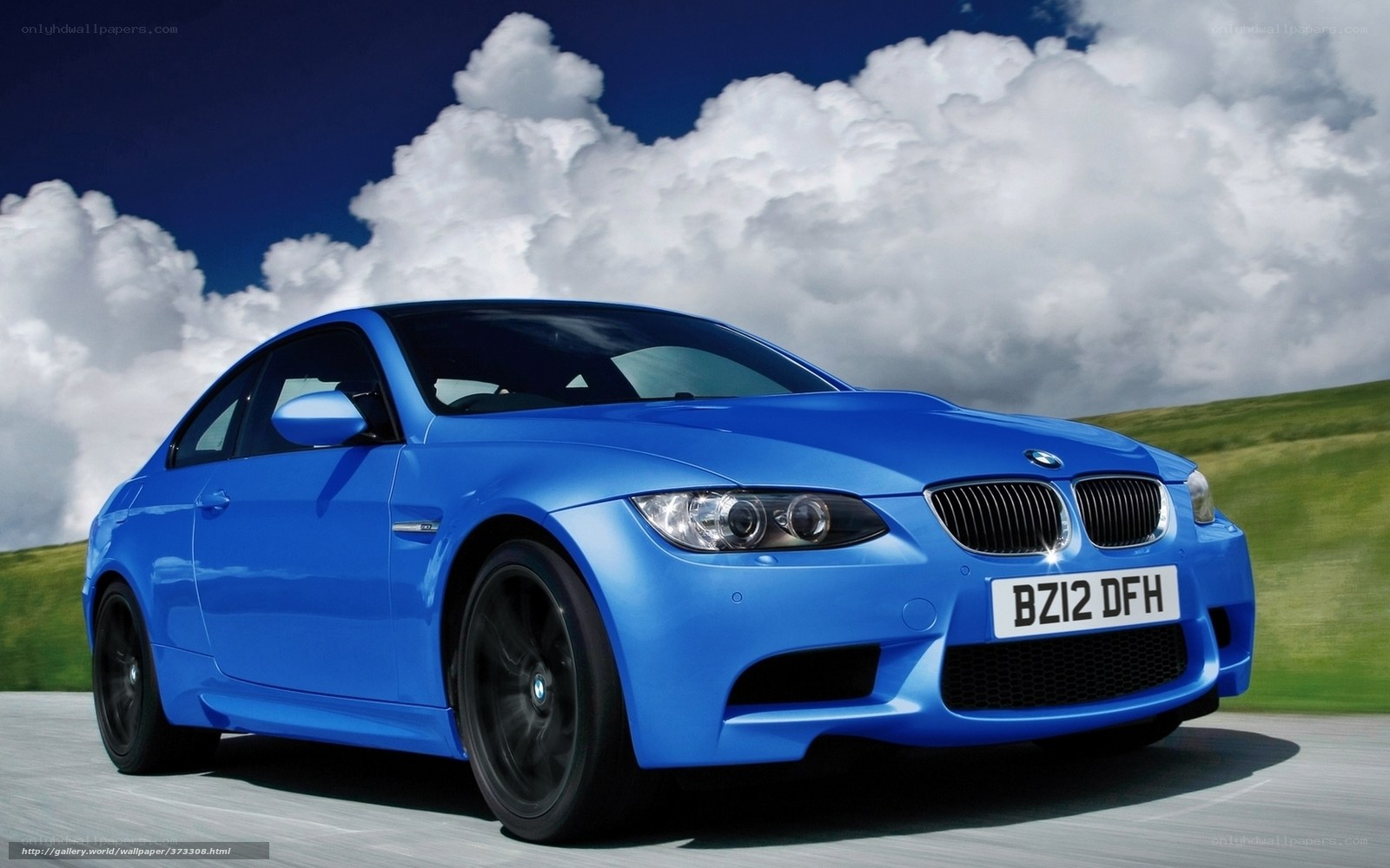 Blue BMW M3 on a road