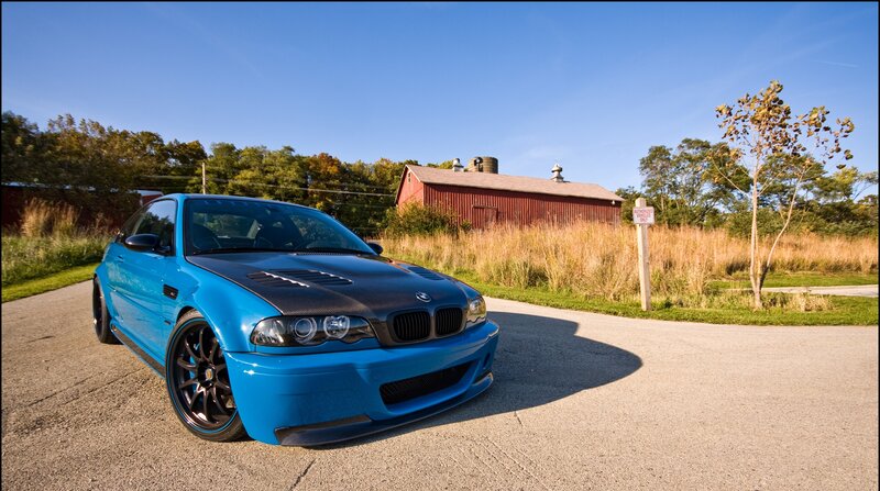 blue bmw m3 on a rural road