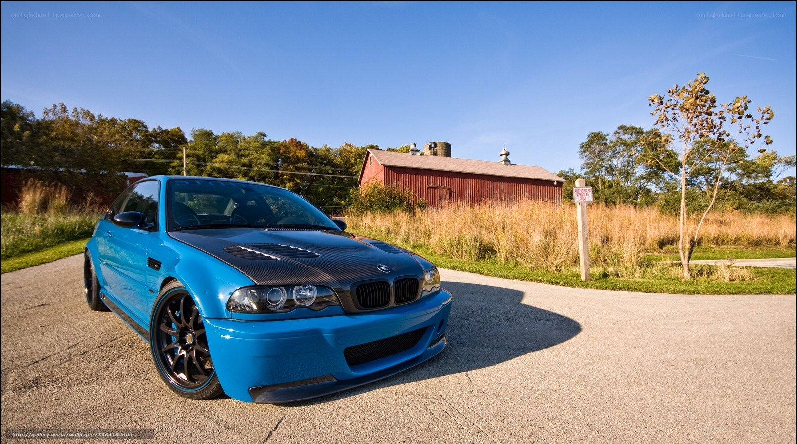 Blue BMW M3 on a rural road