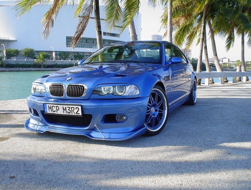 Blue BMW M3 on a waterfront