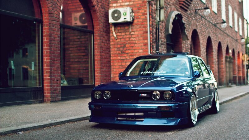 blue bmw m3 on city street