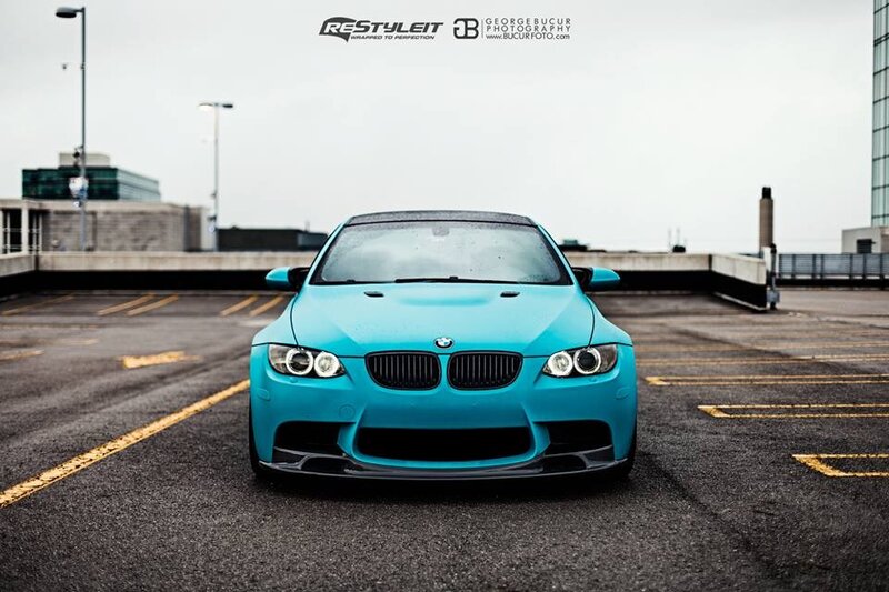 blue bmw m3 on rooftop