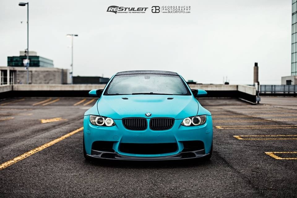 blue bmw m3 on rooftop