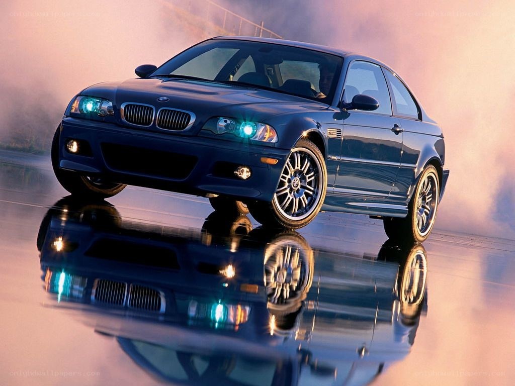 blue bmw m3 on wet surface
