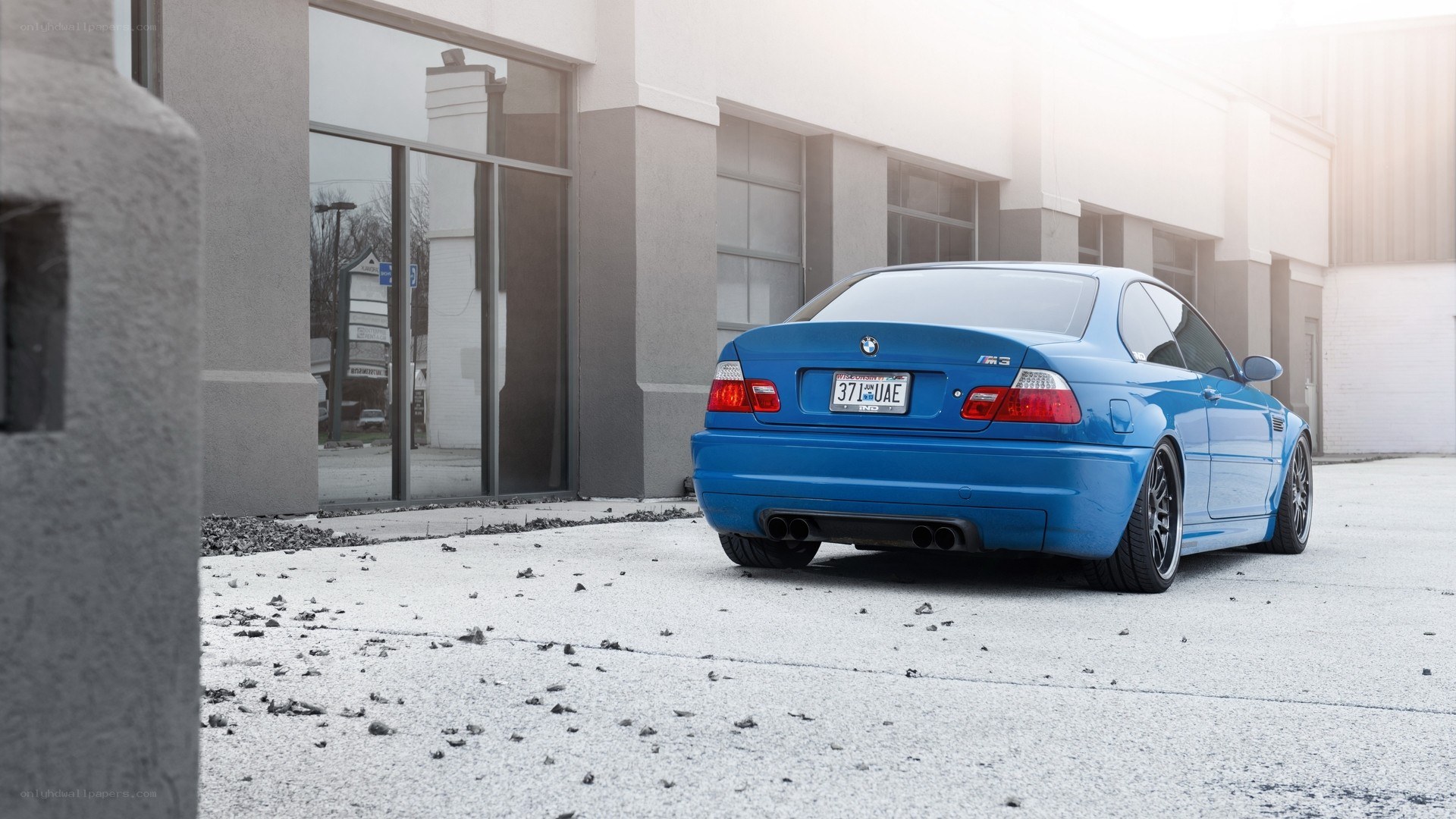 blue bmw m3 parked outside