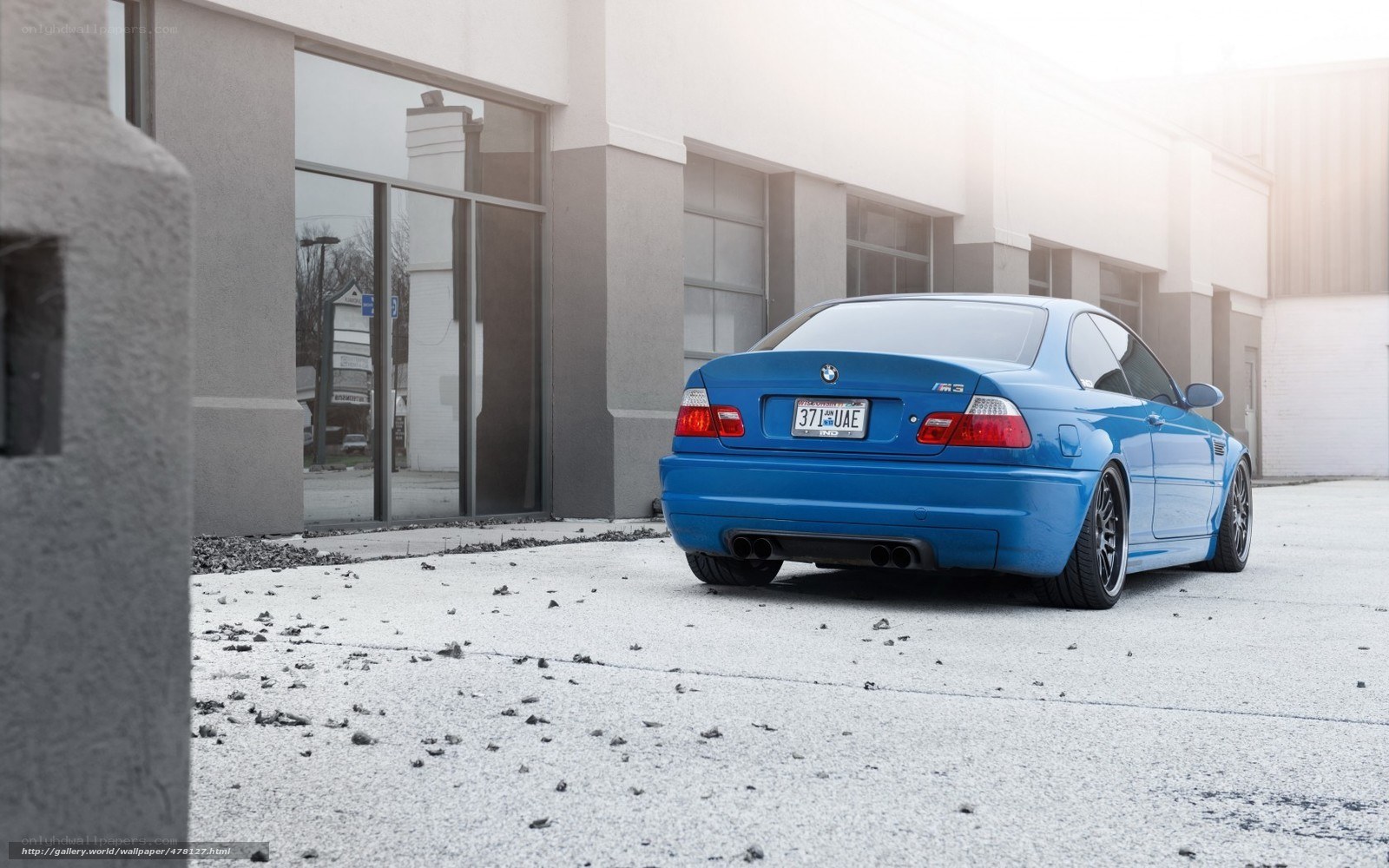 blue bmw m3 parked outside