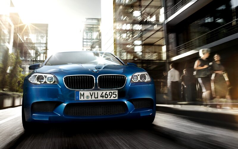Blue BMW M5 in city