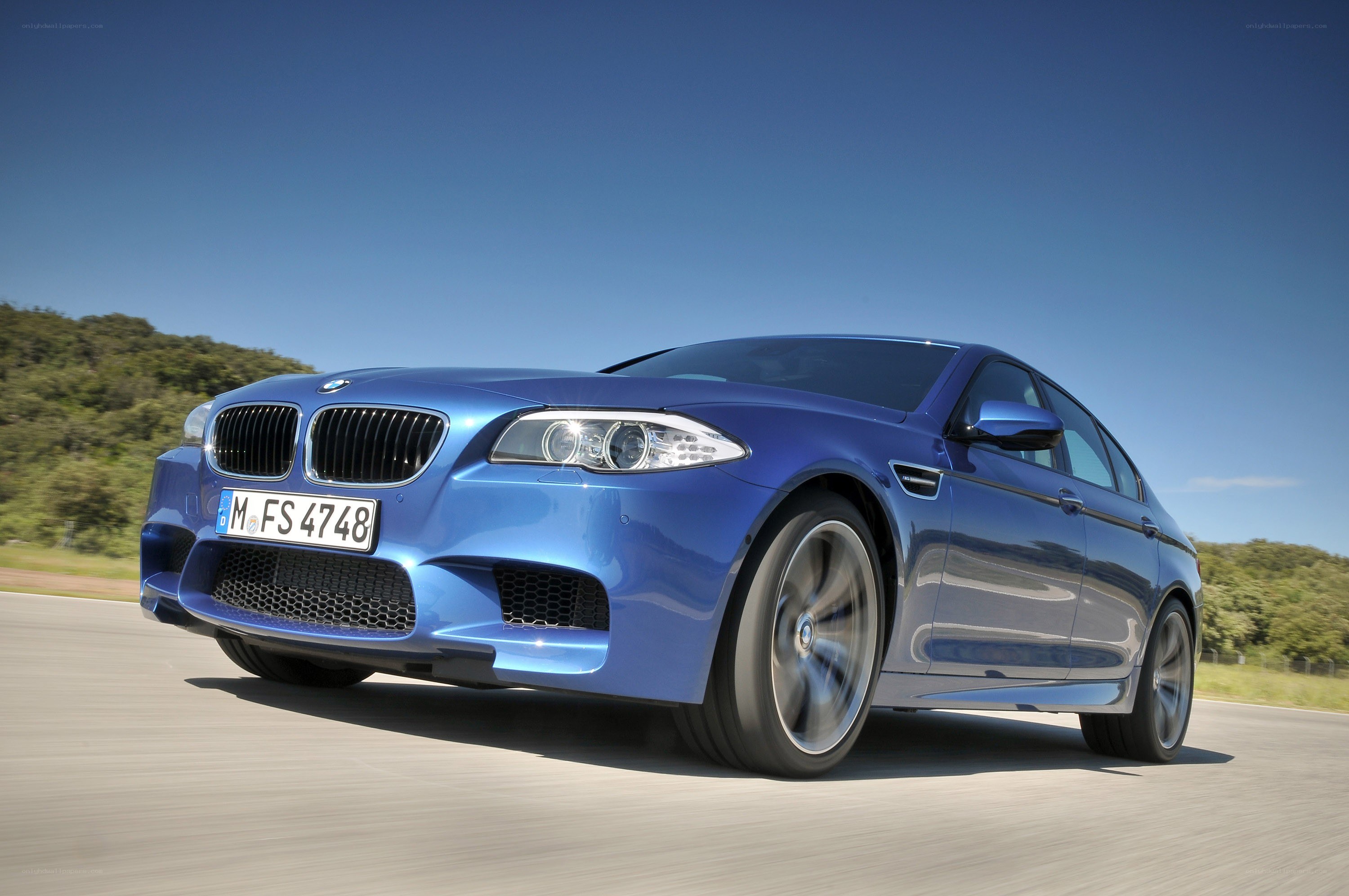 Blue BMW M5 in motion