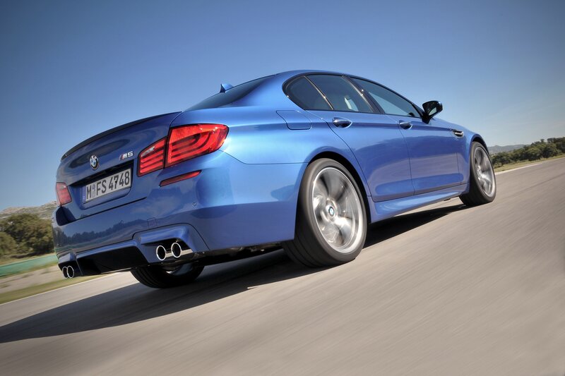 blue bmw m5 in motion