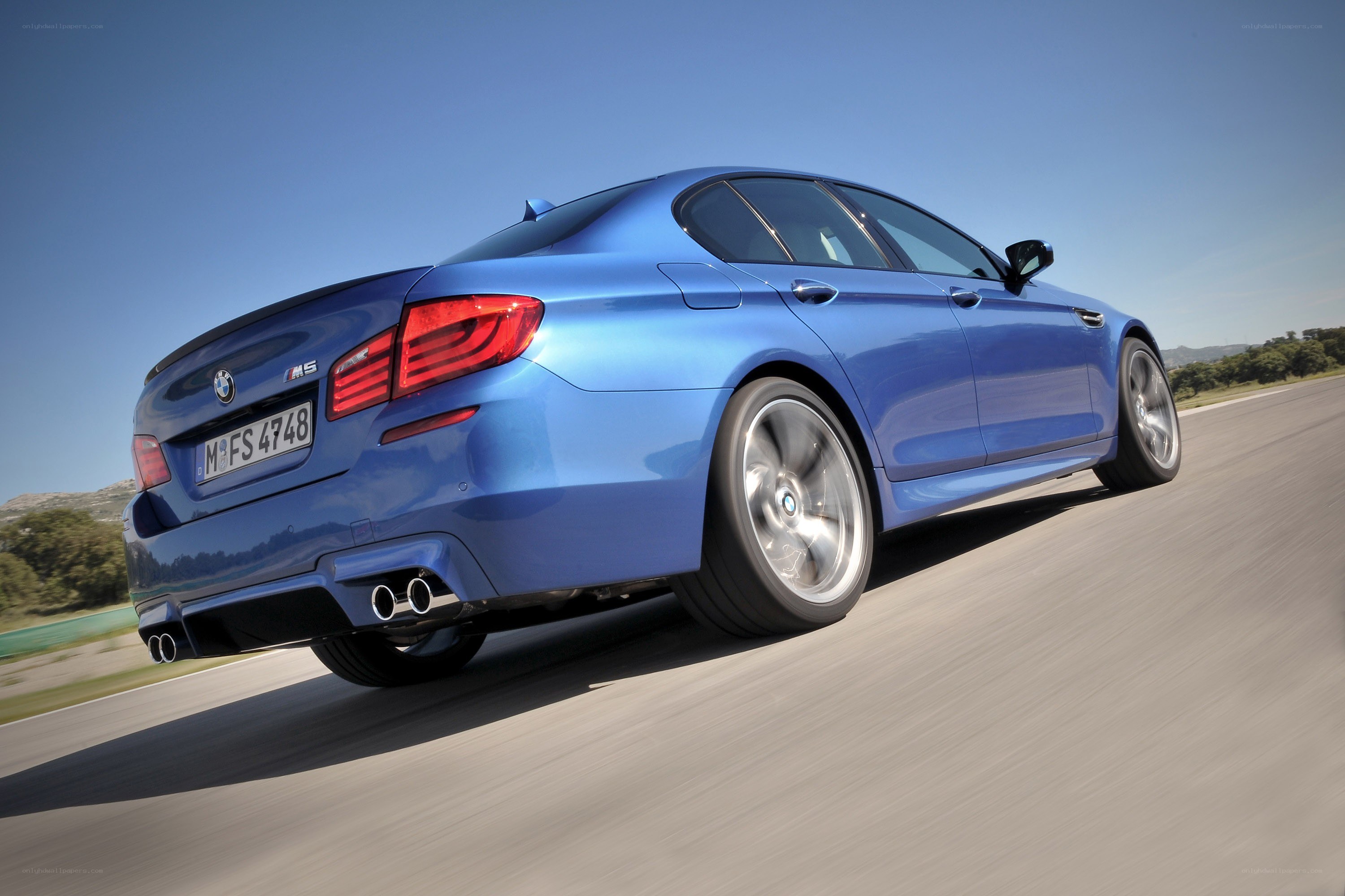 blue bmw m5 in motion