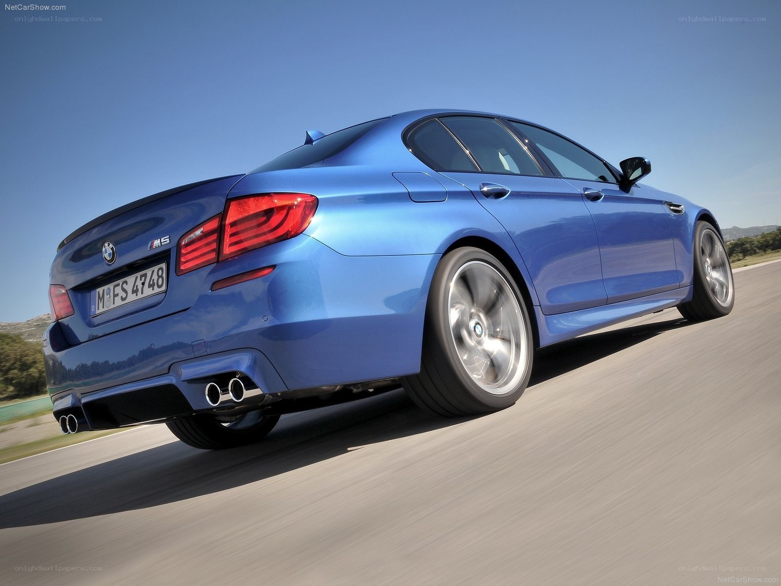 Blue BMW M5 in motion