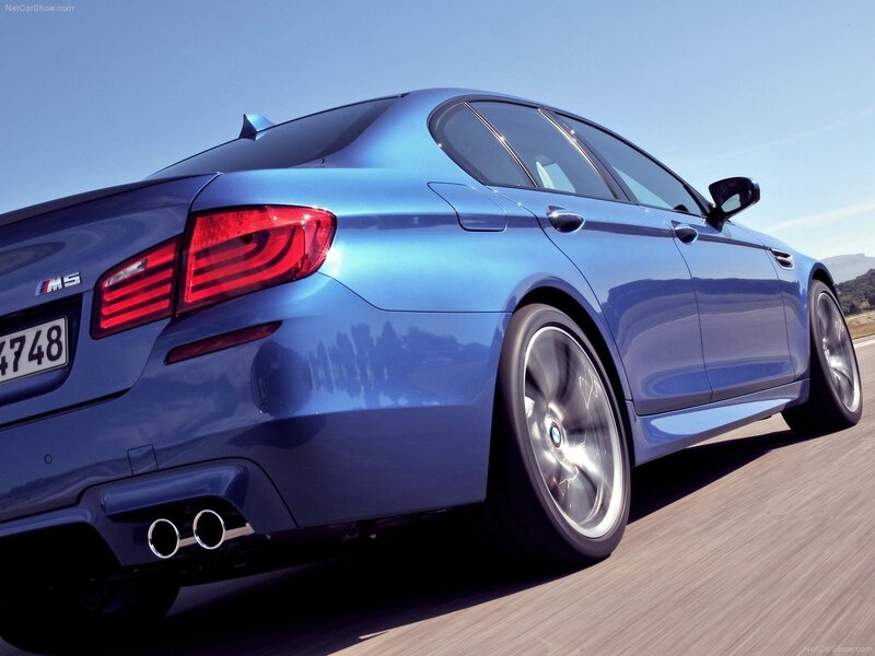 blue bmw m5 in motion